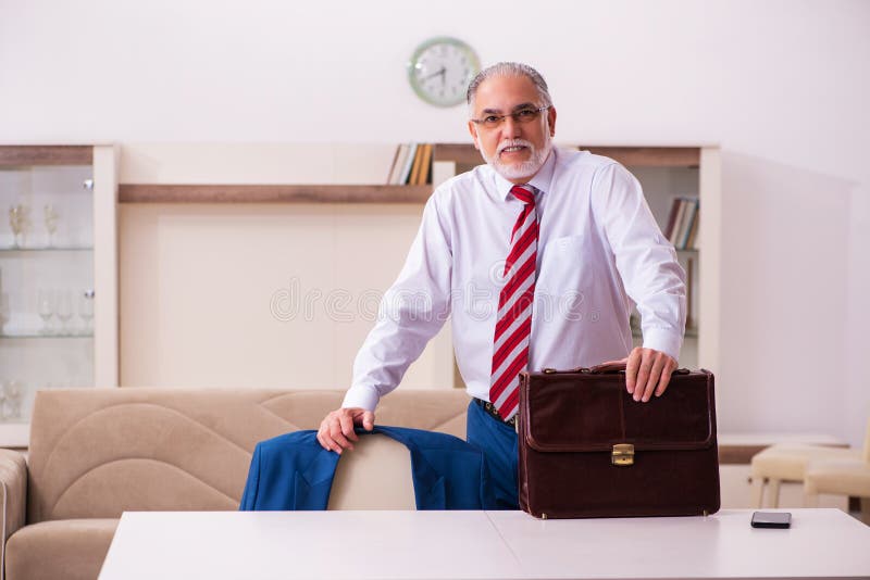 Old male boss employee coming home from work royalty free stock photography