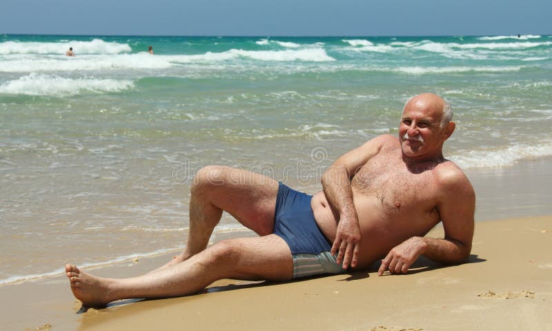 Senior man on the beach royalty free stock images