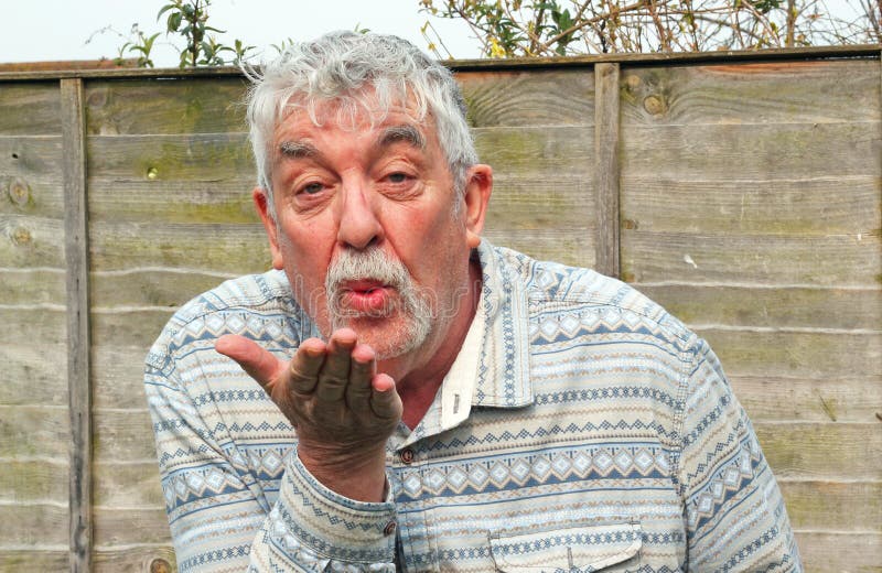 Senior man blowing a kiss closeup. royalty free stock image Senior man blowing a kiss closeup. royalty free stock image