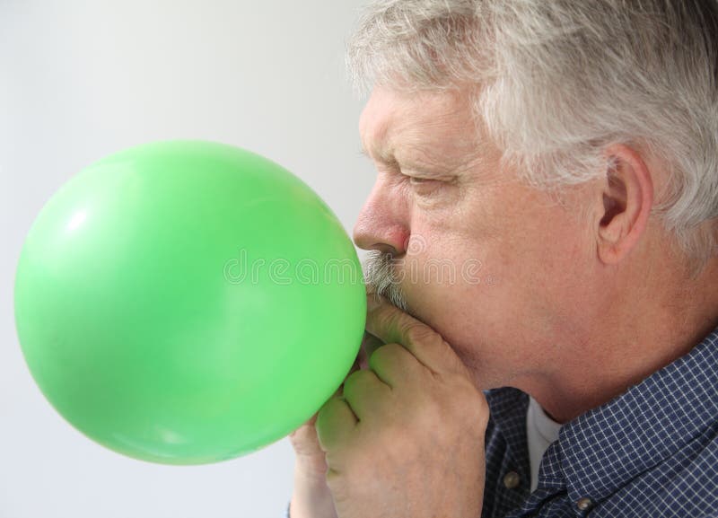 Senior Man Blowing Up Balloon Stock Image Image of hand, face 27194169