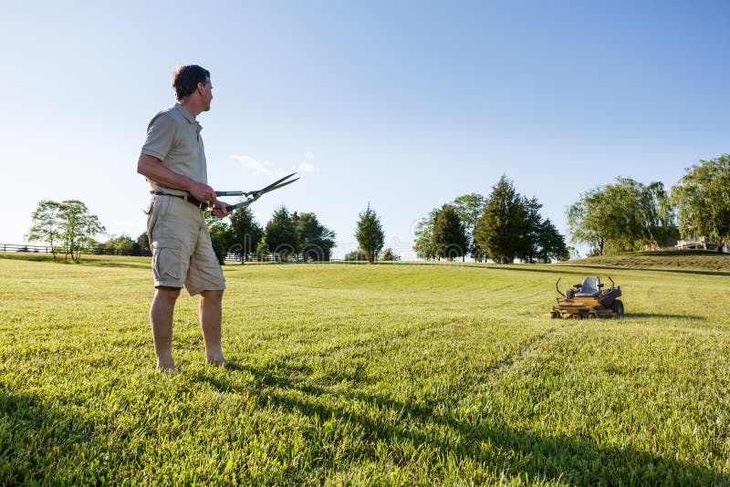 Senior Man Cutting Grass with Shears Stock Image Image of aged, lawn