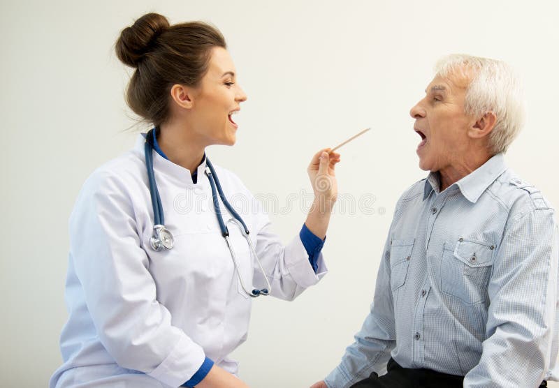Checking for sore throat stock image. Image of confident 21123159