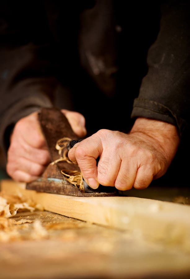 Senior man doing woodworking