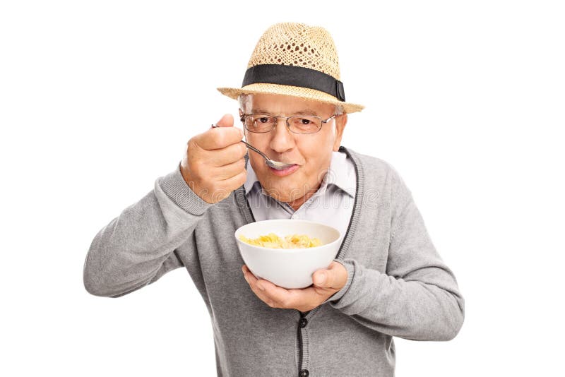 Senior Man Eating Cereal With A Spoon Stock Photo Image 60196863