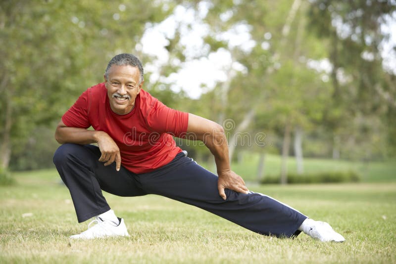 Senior Man Exercising In Park stock photography