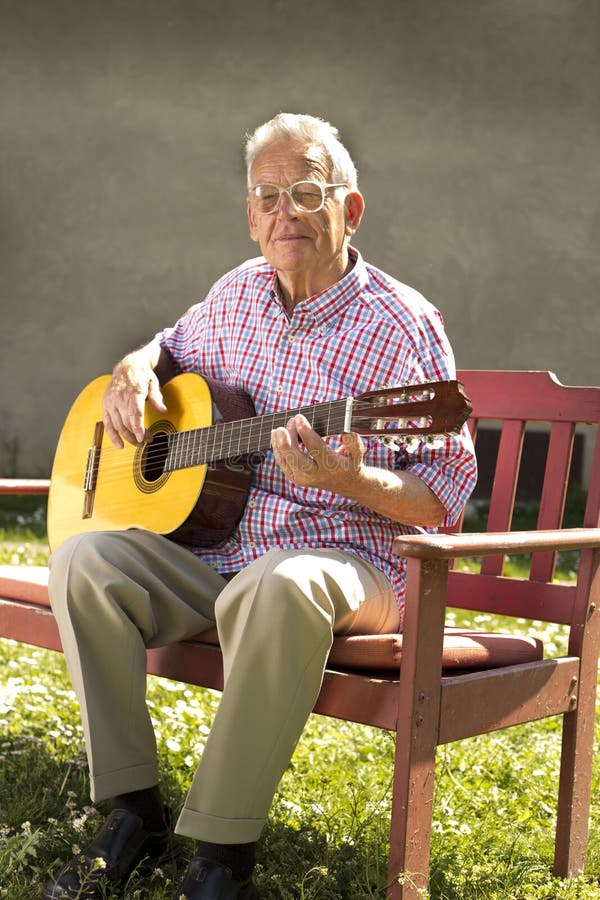 Senior man with guitar stock image. Image of enjoying 40965145