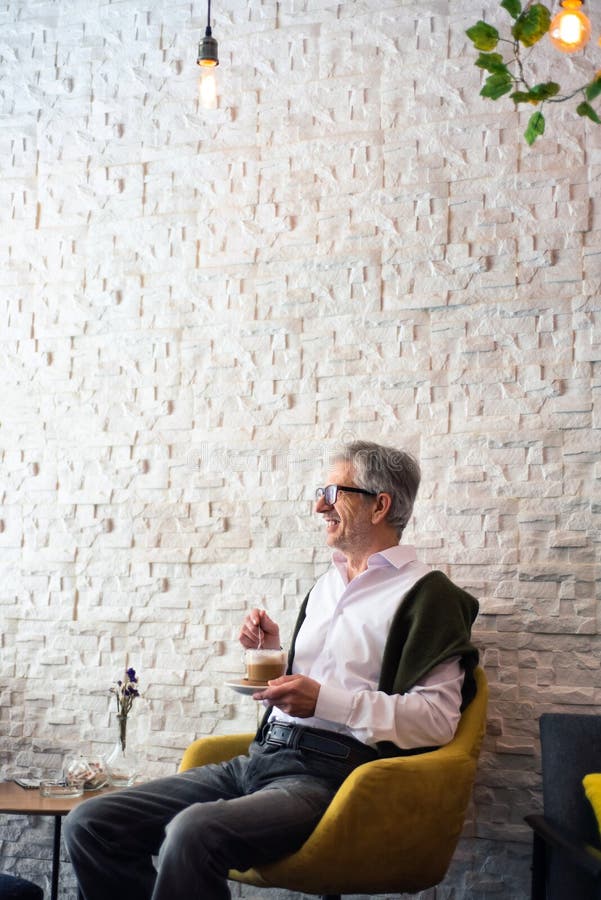 Senior man having a coffee in the bar royalty free stock photography Senior man having a coffee in the bar royalty free stock photography