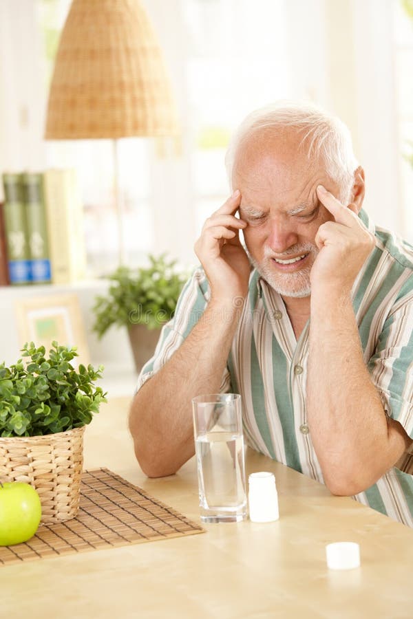 Senior man having headache stock photos Senior man having headache stock photos