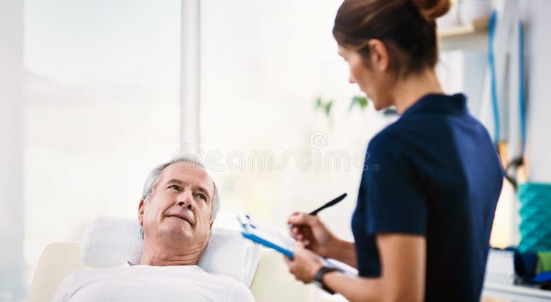 Senior man, healthcare worker and patient rehabilitation while writing on a clipboard for physiotherapy assessment with