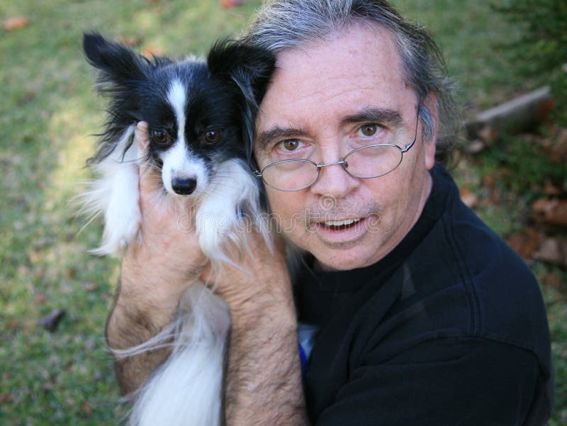 Senior Man and Papillion Dog royalty free stock photos Senior Man and Papillion Dog royalty free stock photos