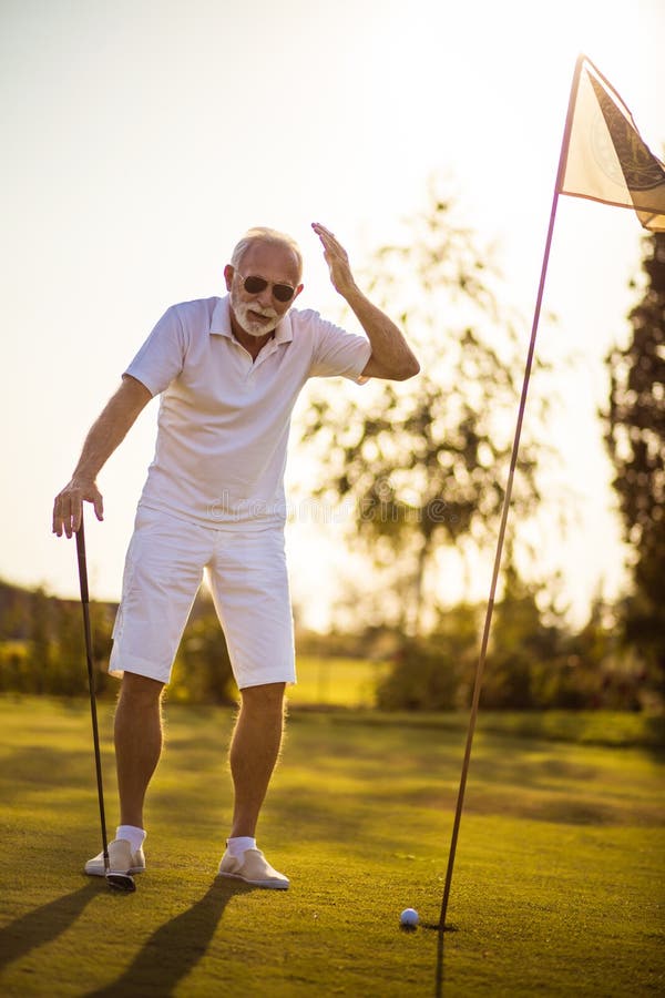 Senior man playing golf stock photo. Image of hobbies 222382050