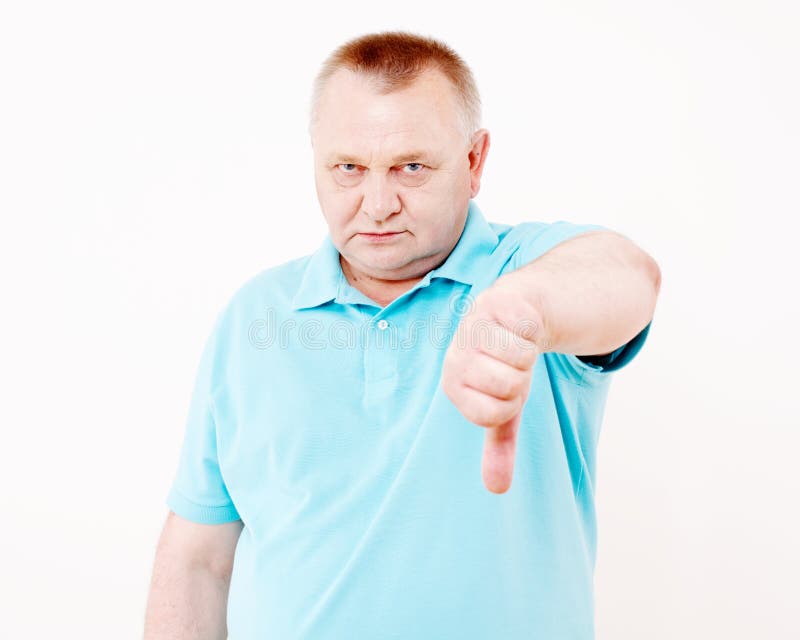 Senior man showing thumb down over white stock images Senior man showing thumb down over white stock images