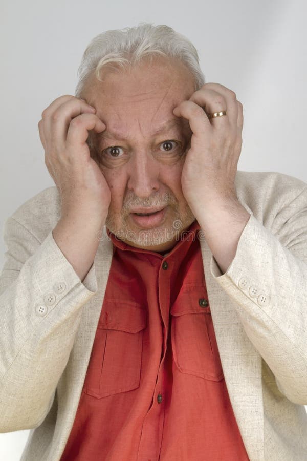 Senior man with strong headache stock photo Senior man with strong headache stock photo
