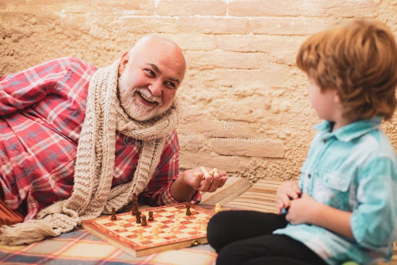 Senior man thinking about his next move in a game of chess Stock Photo by  dmytros9