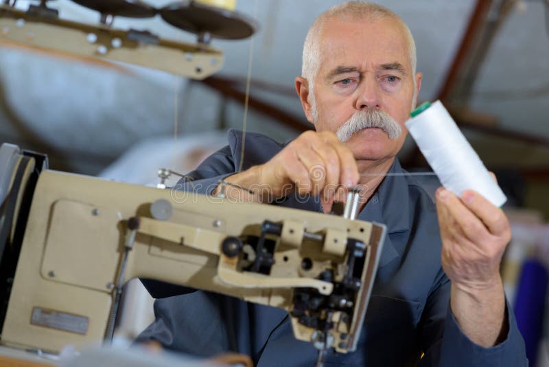 Senior Man Threading Up Industrial Sewing Machine Stock Photo Image of equipment, serious