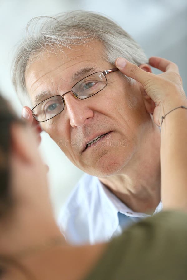 Senior man trying on new eyeglasses