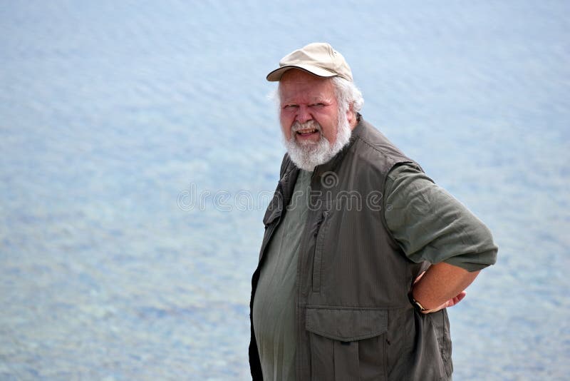 Senior man with water in background royalty free stock photography