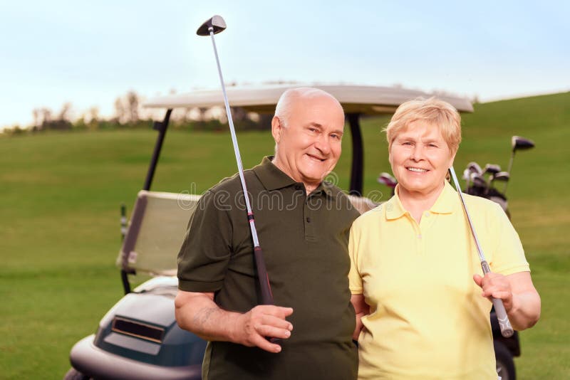 Senior man and woman on background of cart