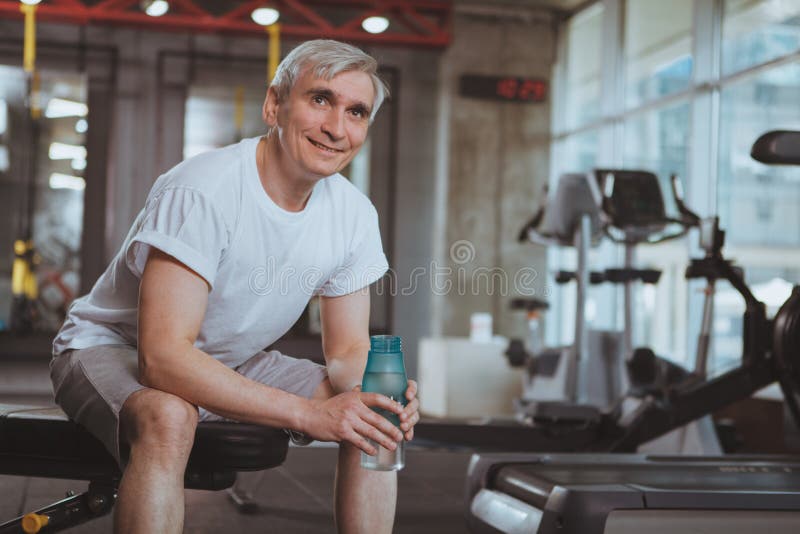 Senior man working out at the gym stock photos Senior man working out at the gym stock photos