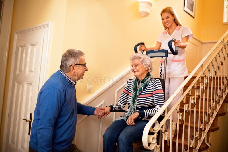 Senior man forgive with his wife while she goes to nursing home royalty free stock photos Senior man forgive with his wife while she goes to nursing home royalty free stock photos