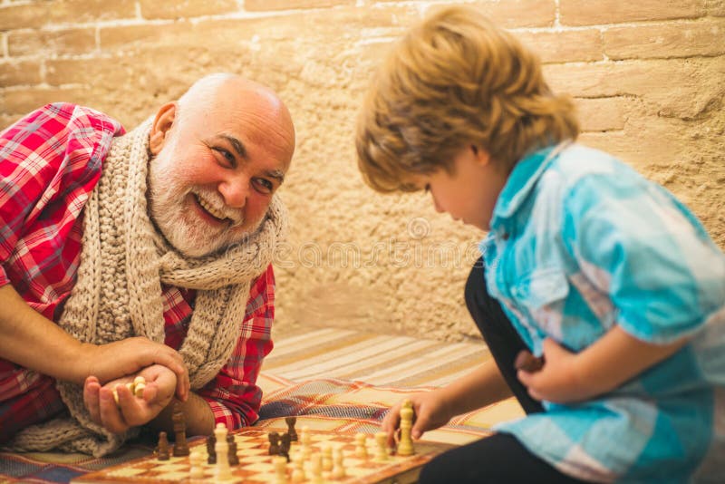 Senior man thinking about his next move in a game of chess Stock Photo by  dmytros9