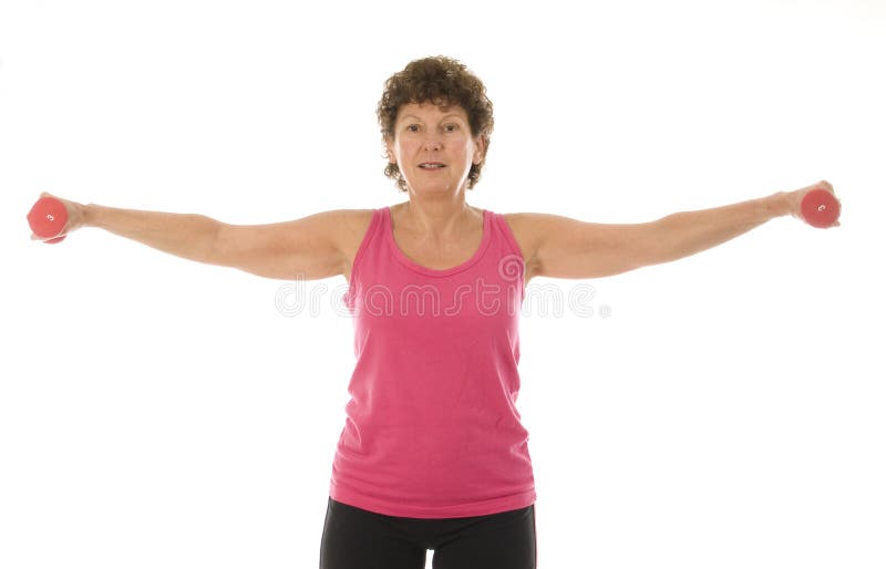Senior middle age woman exercising with dumbbells royalty free stock photos Senior middle age woman exercising with dumbbells royalty free stock photos