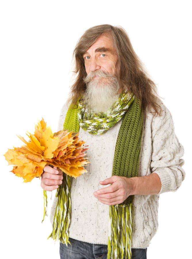 Senior old man holding autumn yellow maple leaves