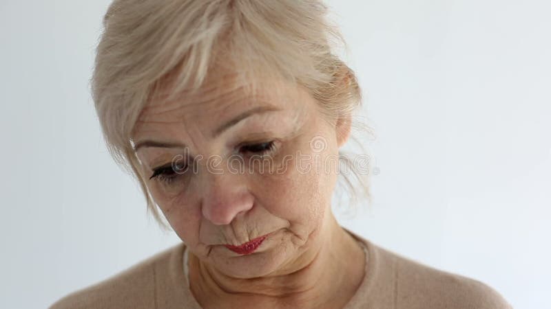 Senior portrait, elderly woman is sad and dissatisfied. Close up