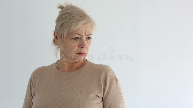 Senior portrait, elderly woman is sad and dissatisfied. Close up