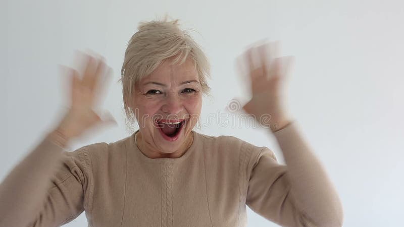 Senior portrait, happy old woman smiling and looking at camera