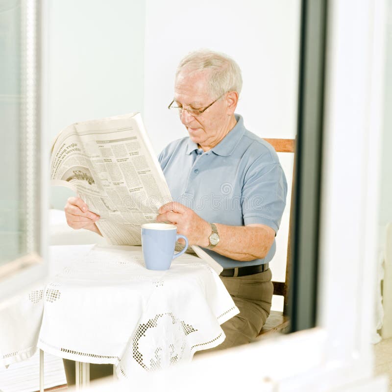 Senior reading a newspaper