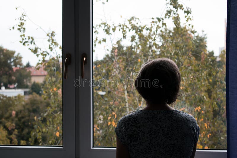 Senior sad lonely old woman look next to window allone depressed abandoned royalty free stock images Senior sad lonely old woman look next to window allone depressed abandoned royalty free stock images