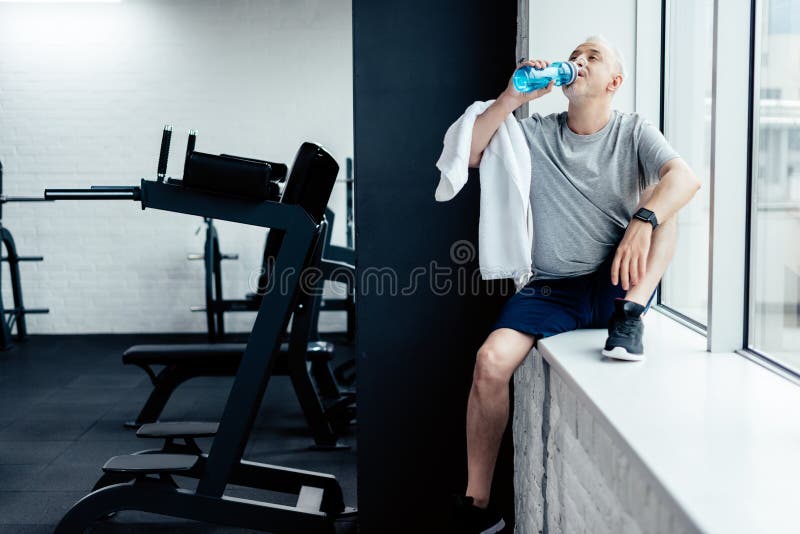 senior sportsman resting and drink water stock photos senior sportsman resting and drink water stock photos