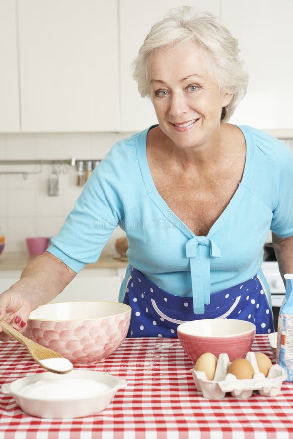 Senior Woman Baking in Kitchen Stock Image Image of mixing, camera