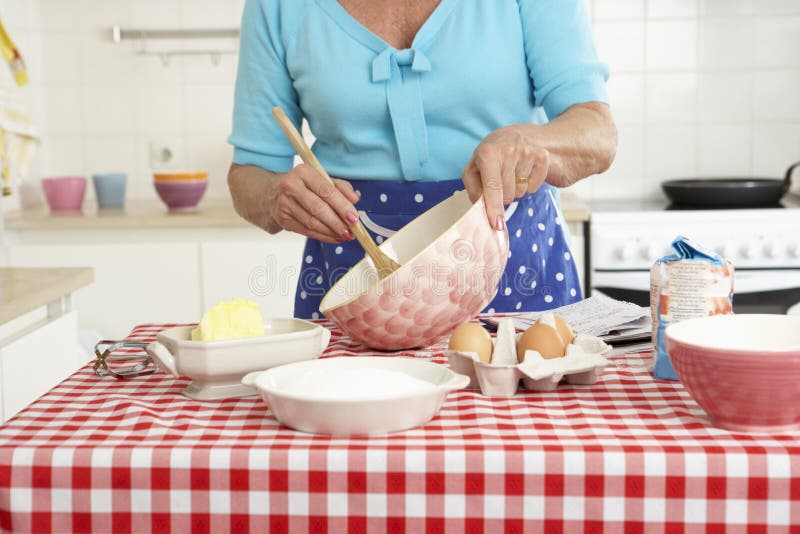 Senior Woman Baking in Kitchen Stock Image Image of caucasian, apron