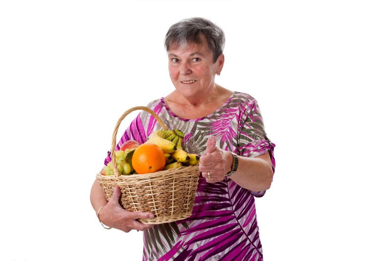 Senior woman with basket of fruit