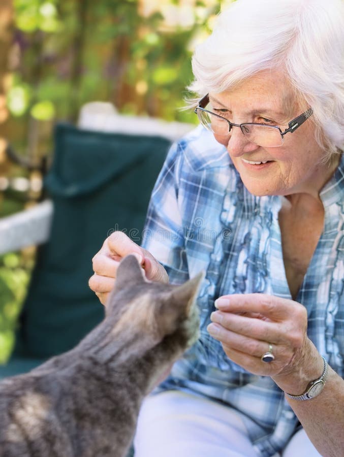 Senior woman and cat