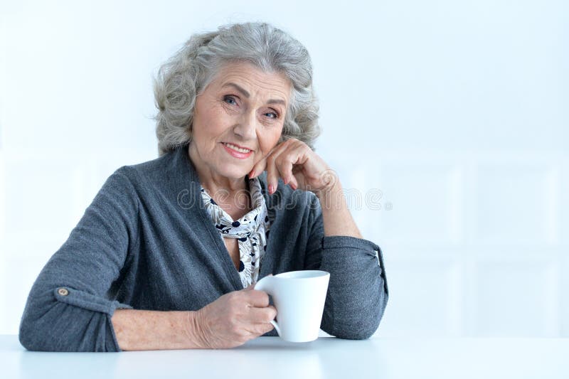 Senior woman with cup of coffee