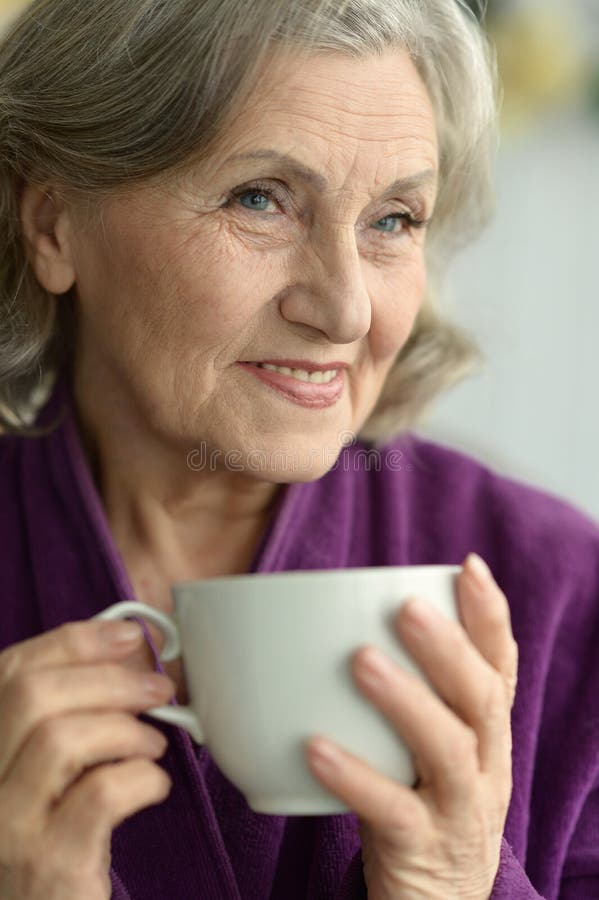 Senior woman with cup of coffee