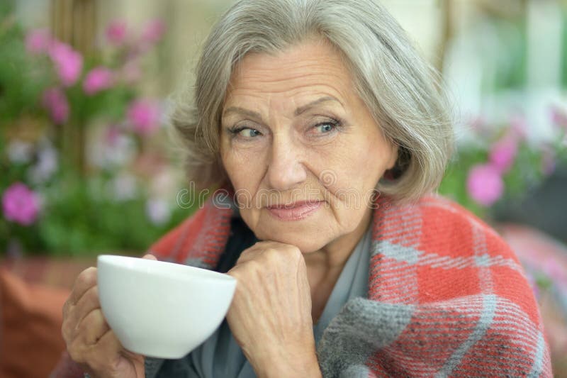 Senior woman with cup