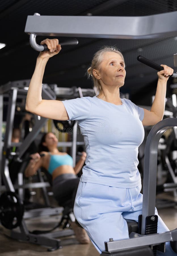 Gym Workout. Woman Exercising, Doing Front Lat Pulldown Exercise