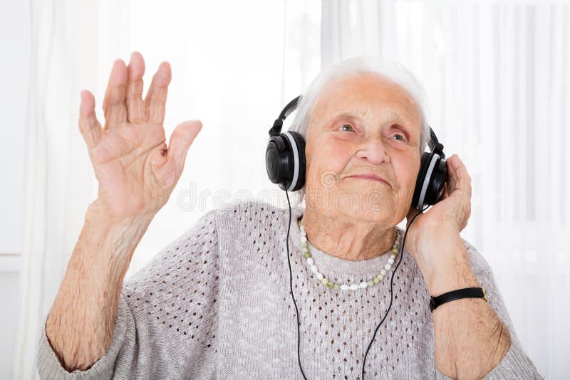 Senior Woman Enjoying Music With Headphone