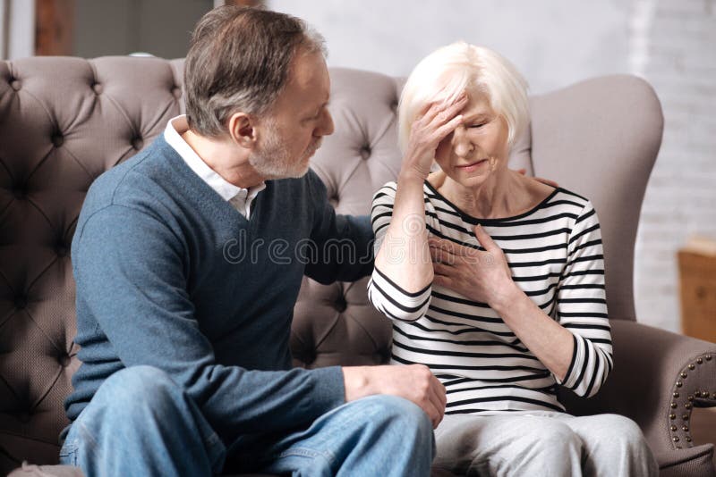 Senior woman feeling bad near her husband stock images Senior woman feeling bad near her husband stock images