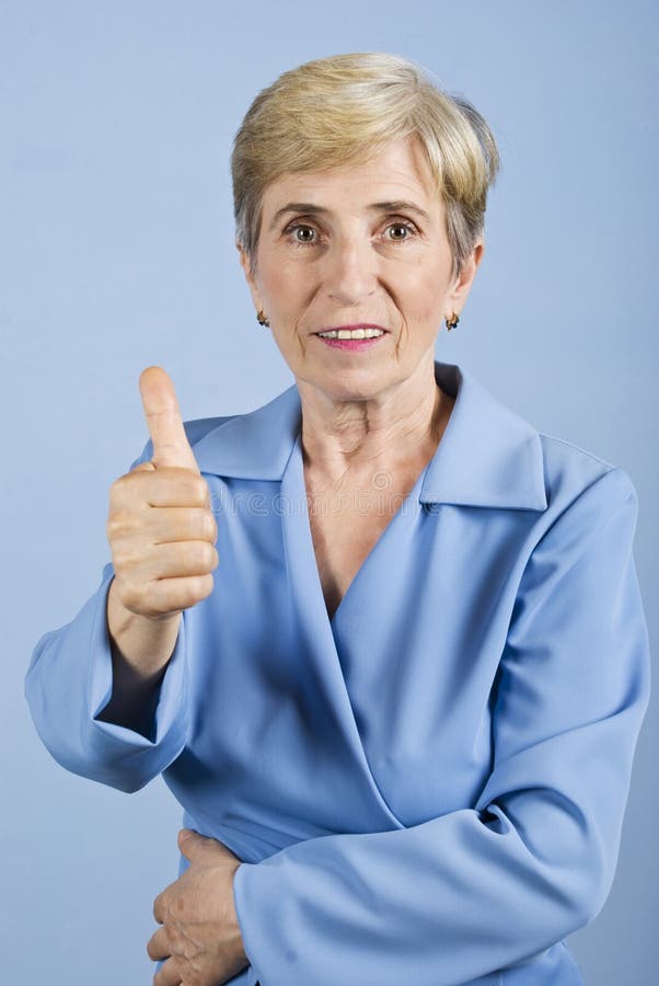 Senior woman giving thumbs up