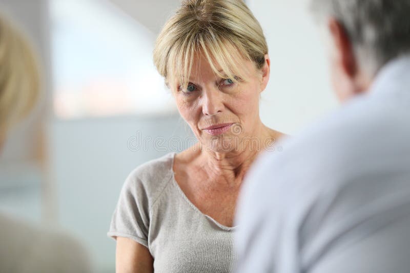 Senior woman in group therapy royalty free stock photography Senior woman in group therapy royalty free stock photography