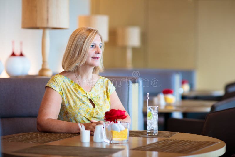 Senior woman in cafe. Lady in restaurant