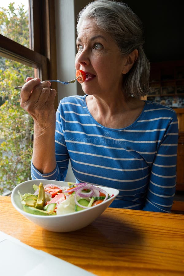 Senior woman having a salad royalty free stock photos Senior woman having a salad royalty free stock photos