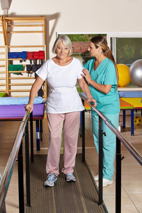 Senior woman holding railing