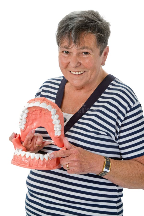 Senior woman pointing on tooth