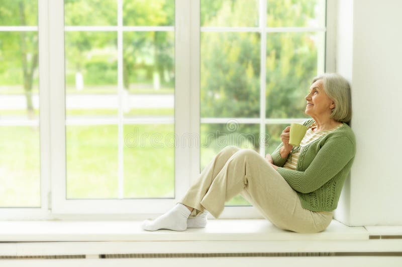 Senior woman portrait with cup of tea